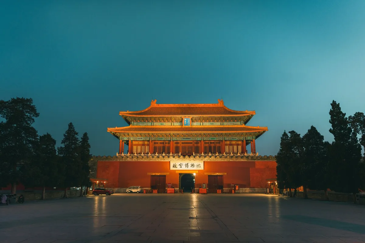 Forbidden City north gate illuminated after sunset in Beijing