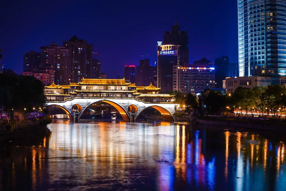 Anshun Bridge illuminated beside the Jinjiang River in Chengdu