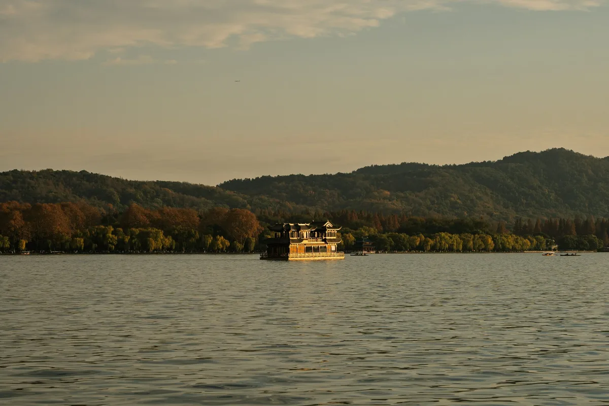 West Lake sightseeing boat in Hangzhou near sunset