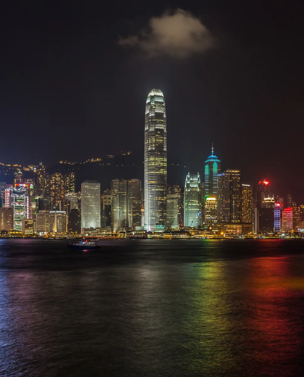 Hong Kong Island skyline across Victoria Harbour from Kowloon at night