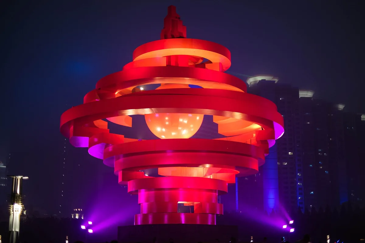 May Wind sculpture illuminated at May Fourth Square in Qingdao at night