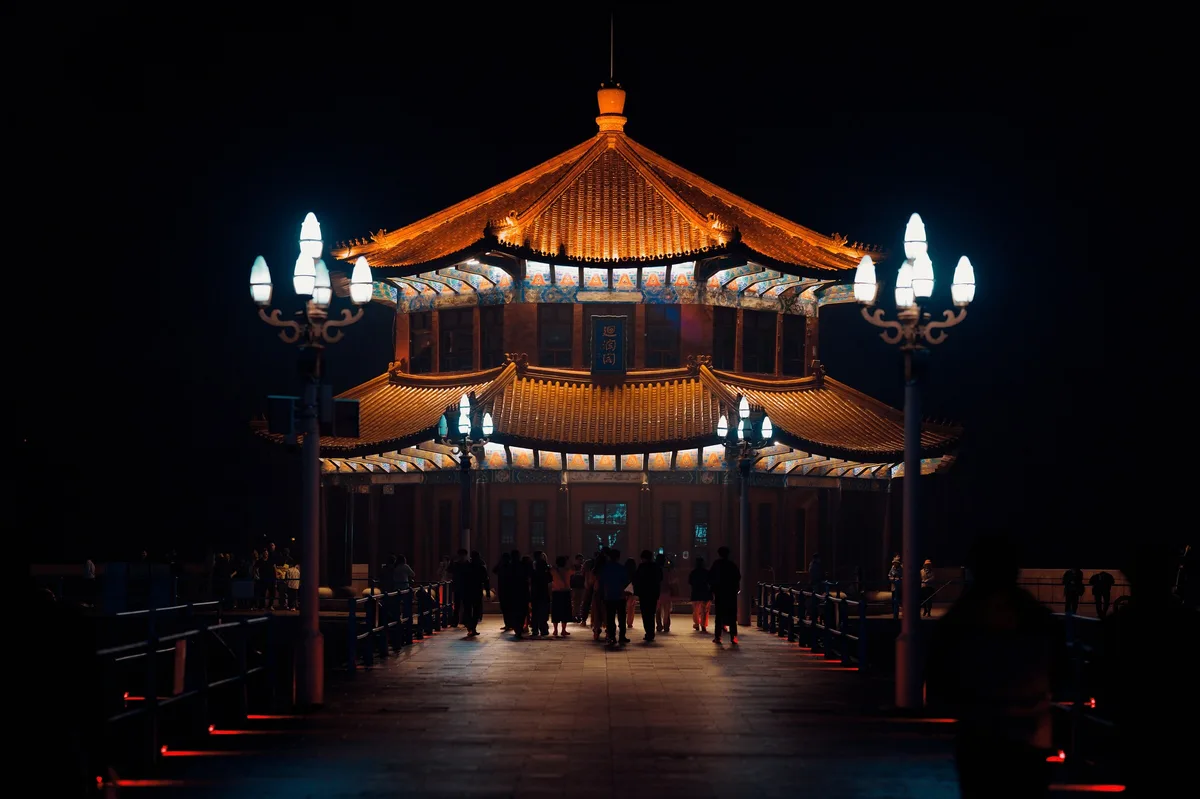 Huilan Pavilion illuminated at night on Zhanqiao Pier in Qingdao