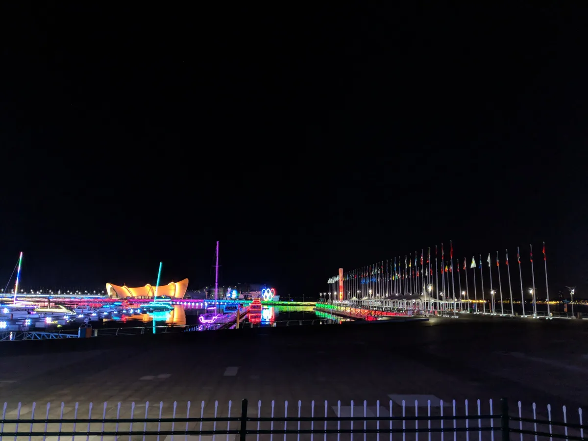 Qingdao International Sailing Centre and waterfront lights at night