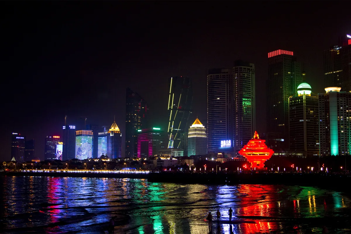 Qingdao skyline and May Fourth Square waterfront at night