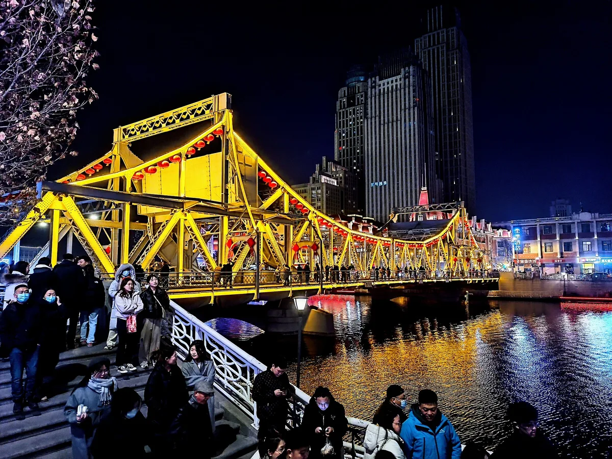 Jiefang Bridge illuminated over the Haihe River in Tianjin at night