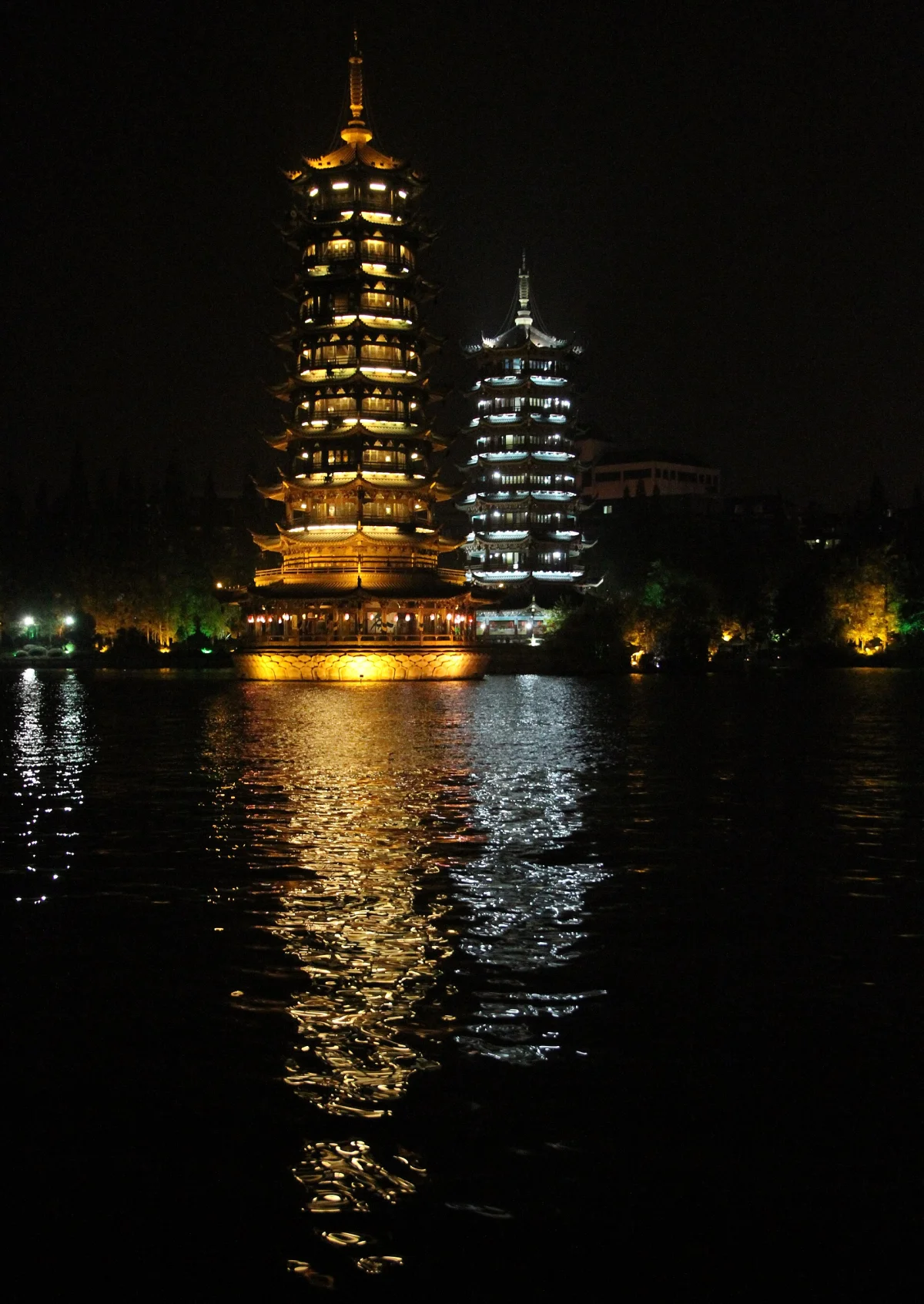 Sun and Moon Pagodas and lake reflections at night in Guilin