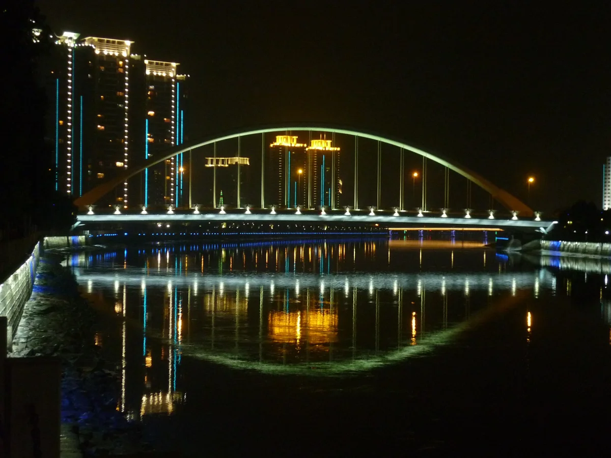 Harp Bridge reflected in the river at night in Ningbo