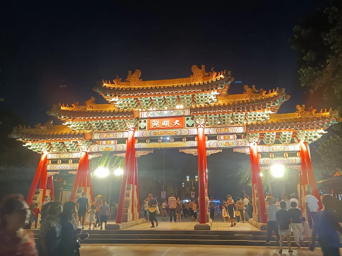 Daming Lake entrance arch illuminated at night in Jinan