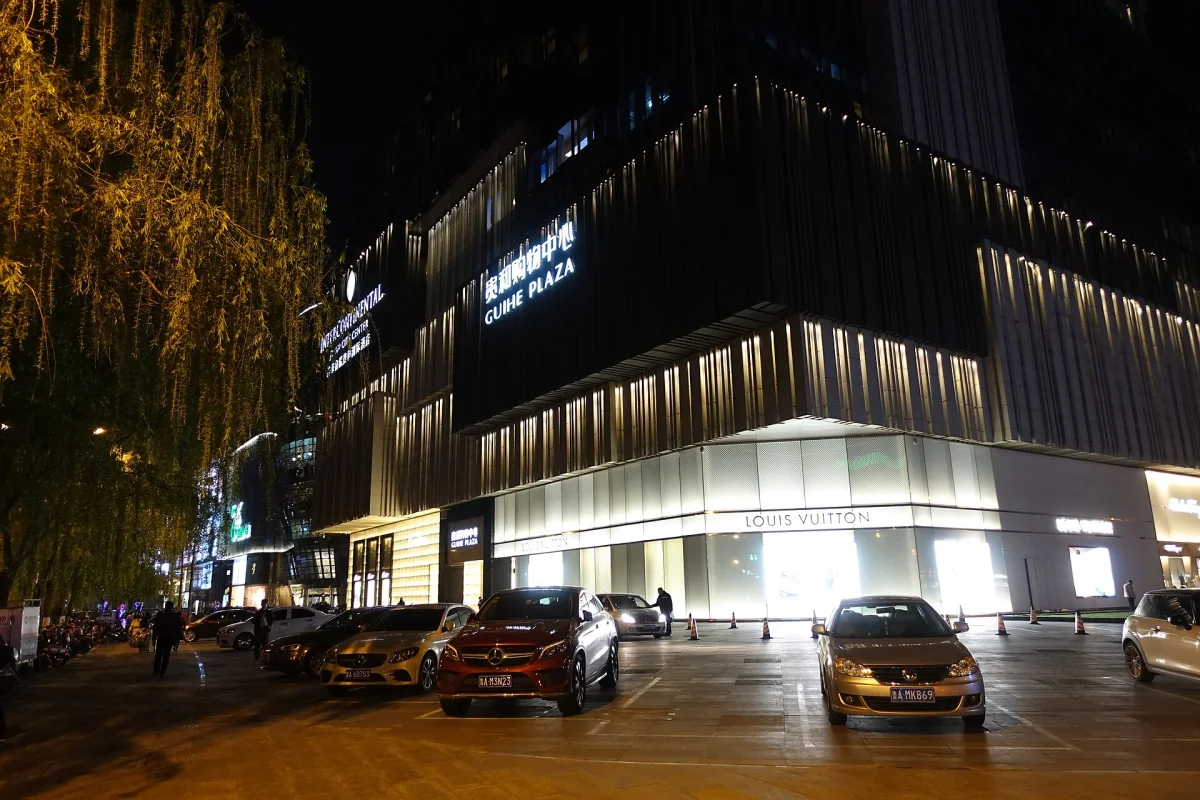 Guihe Shopping Center illuminated street scene at night in Jinan