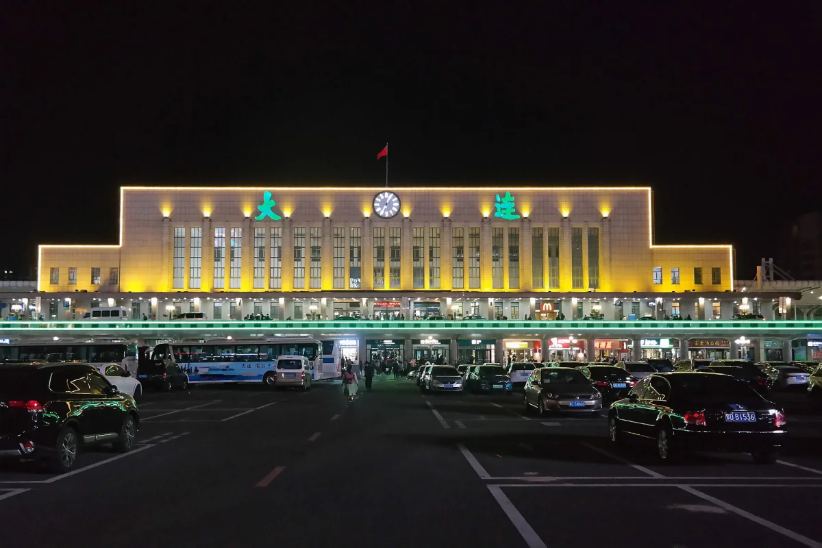 Dalian Railway Station front facade illuminated at night