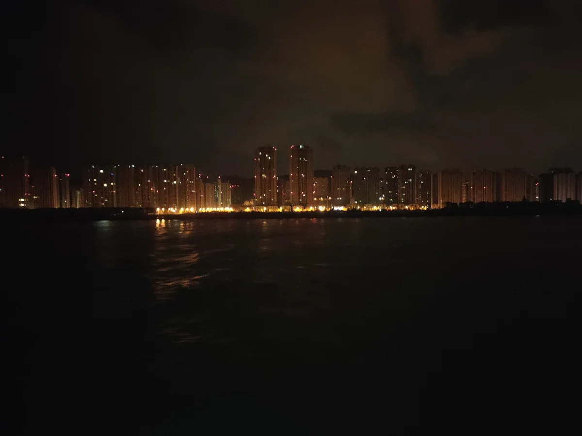 Dalian Zhongshan District skyscrapers seen from the harbor at night
