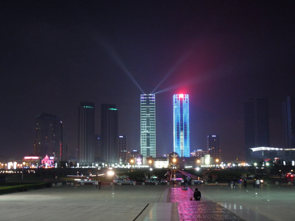 Xinghai Square high-rise lights and beams at night in Dalian
