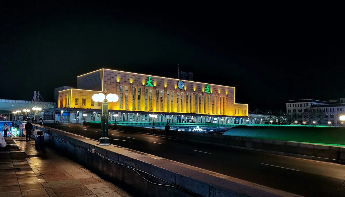Dalian Station building and plaza lights from an angled night view