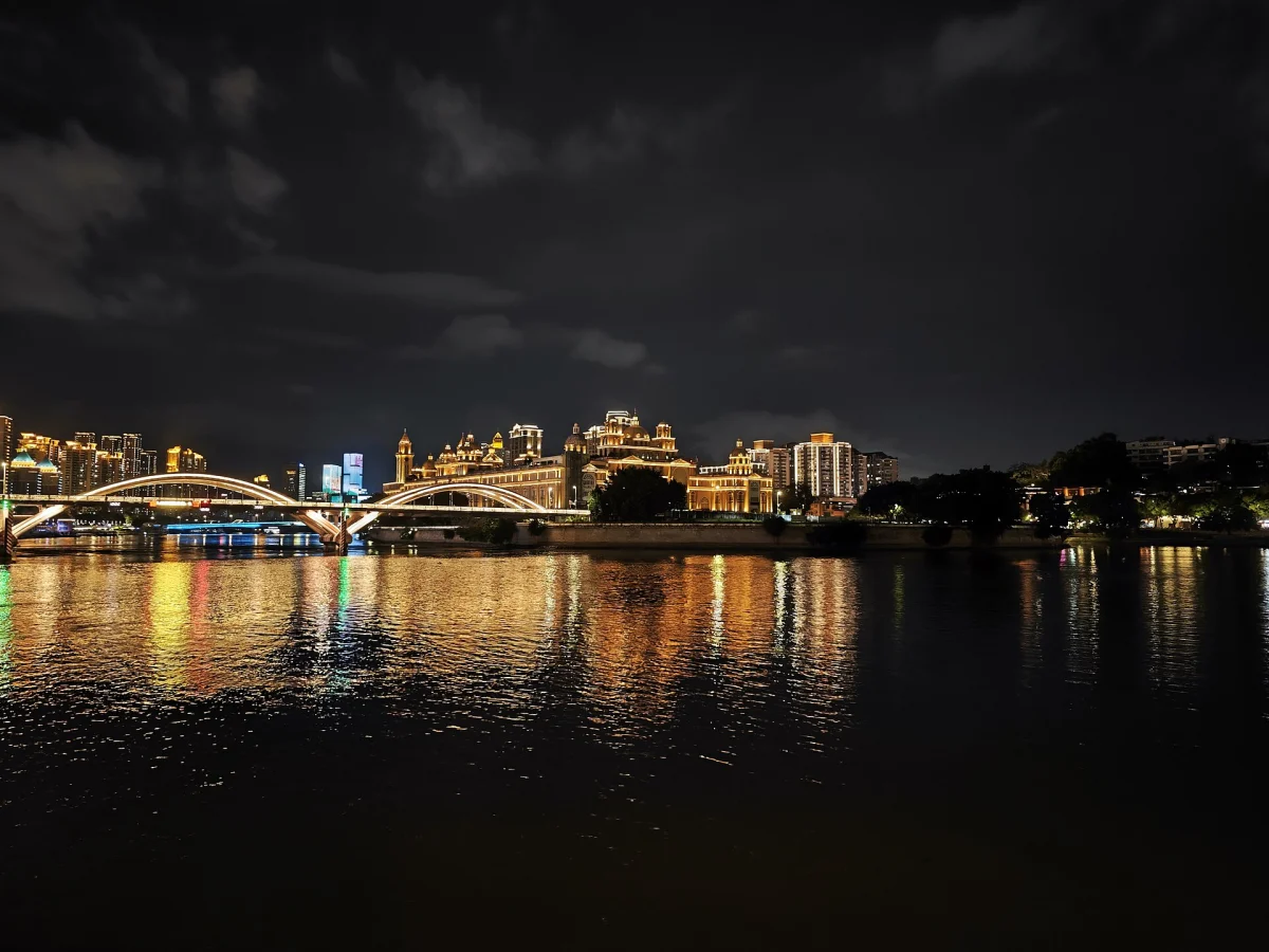 Zhongzhou Island bridge lights reflected on the Min River at night in Fuzhou