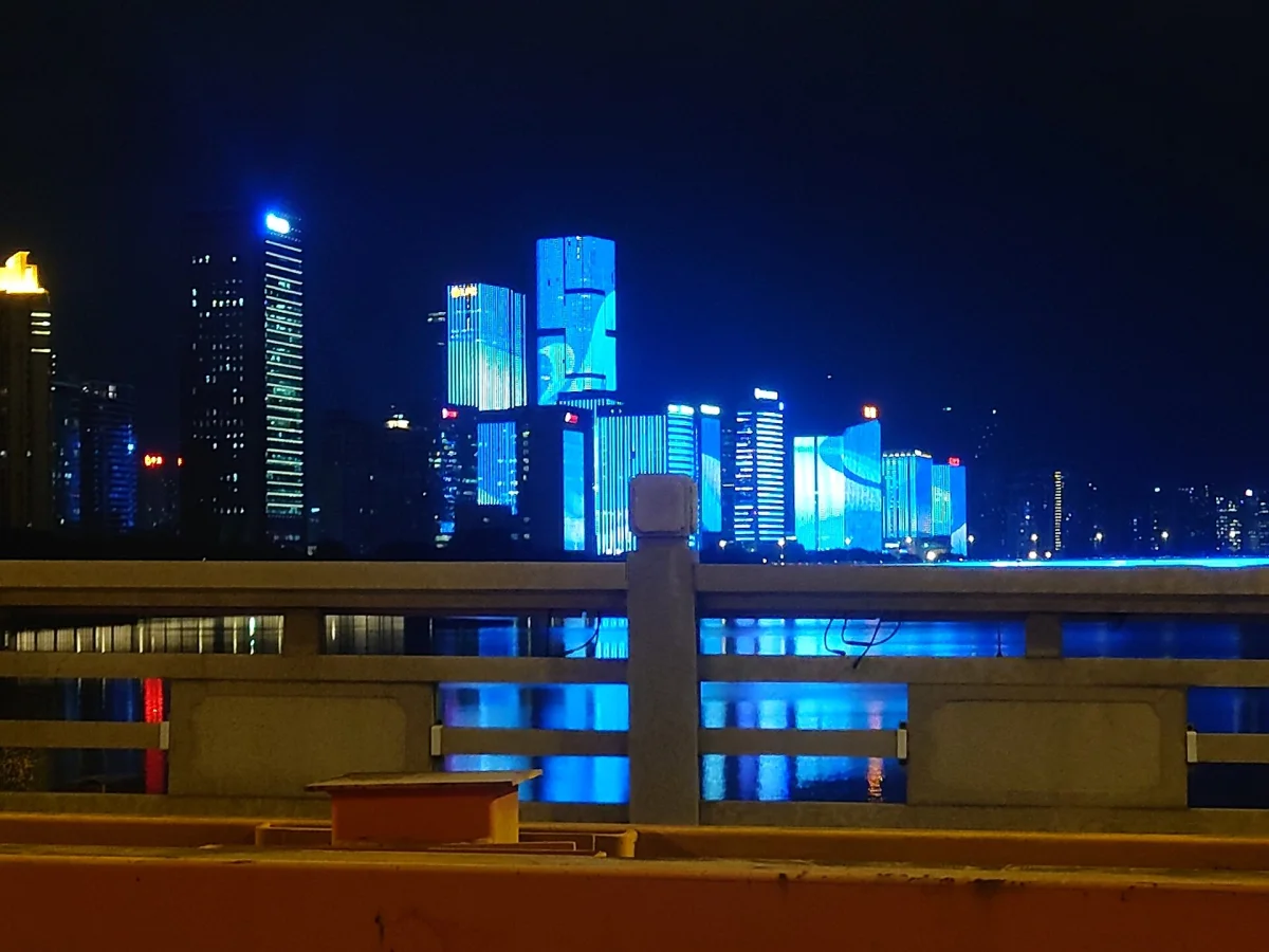 Taijiang skyline lights across the Min River at night in Fuzhou