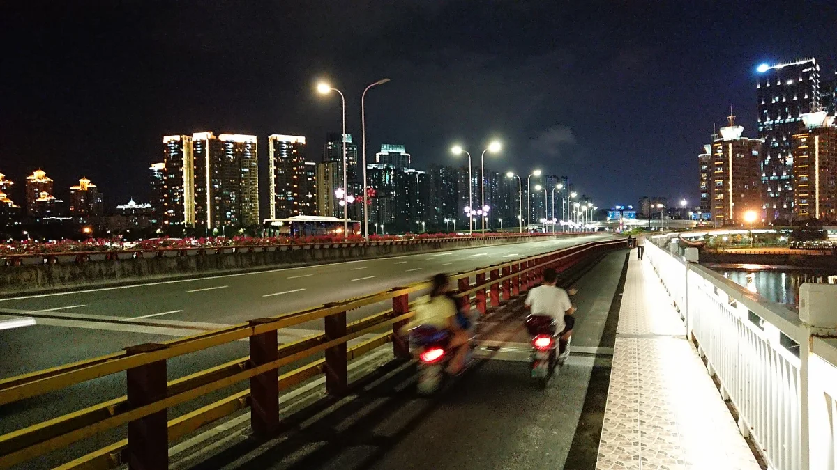 Taijiang side of Jinshan Bridge with road and skyline lights at night in Fuzhou