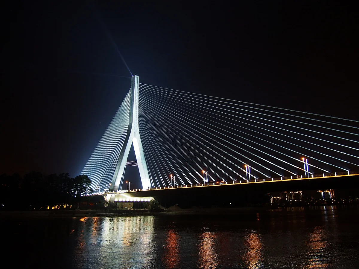 Sanxianzhou Bridge illuminated across the river at night in Fuzhou