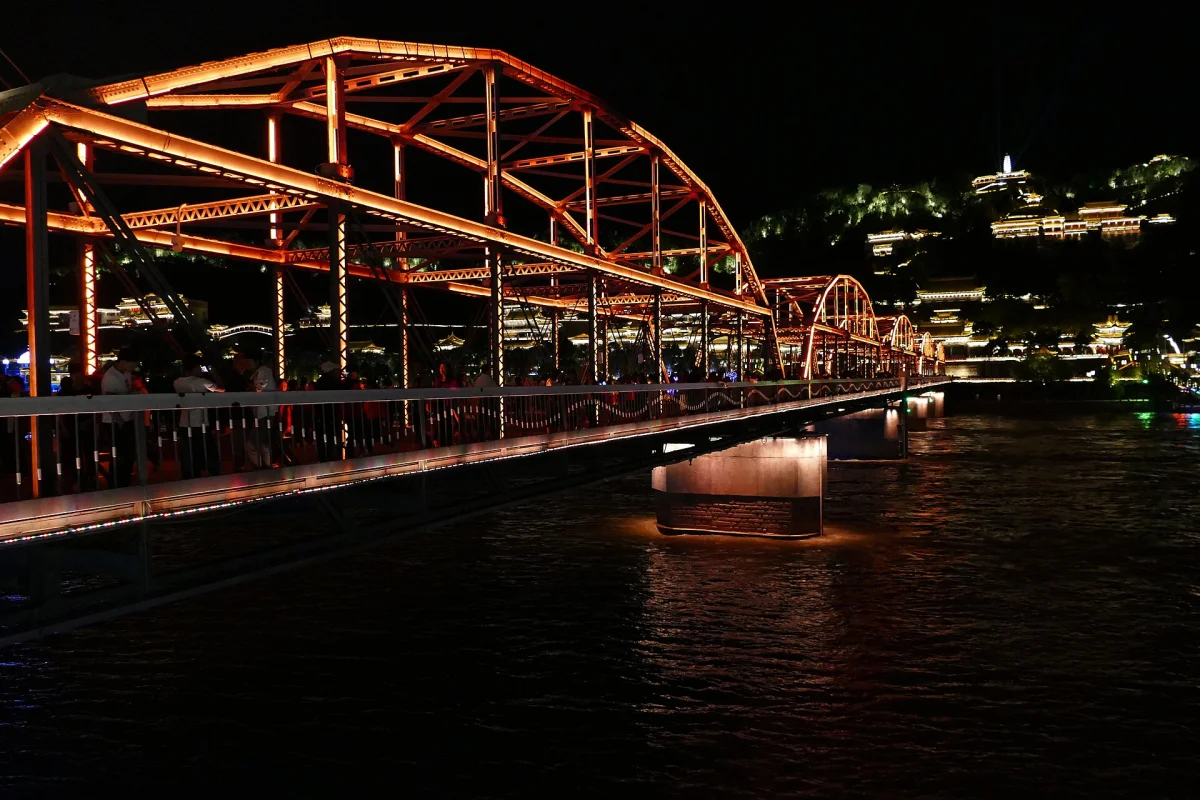 Zhongshan Bridge glowing over the Yellow River at night in Lanzhou