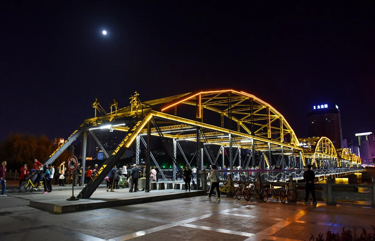 Zhongshan Bridge under the moon above the Yellow River at night