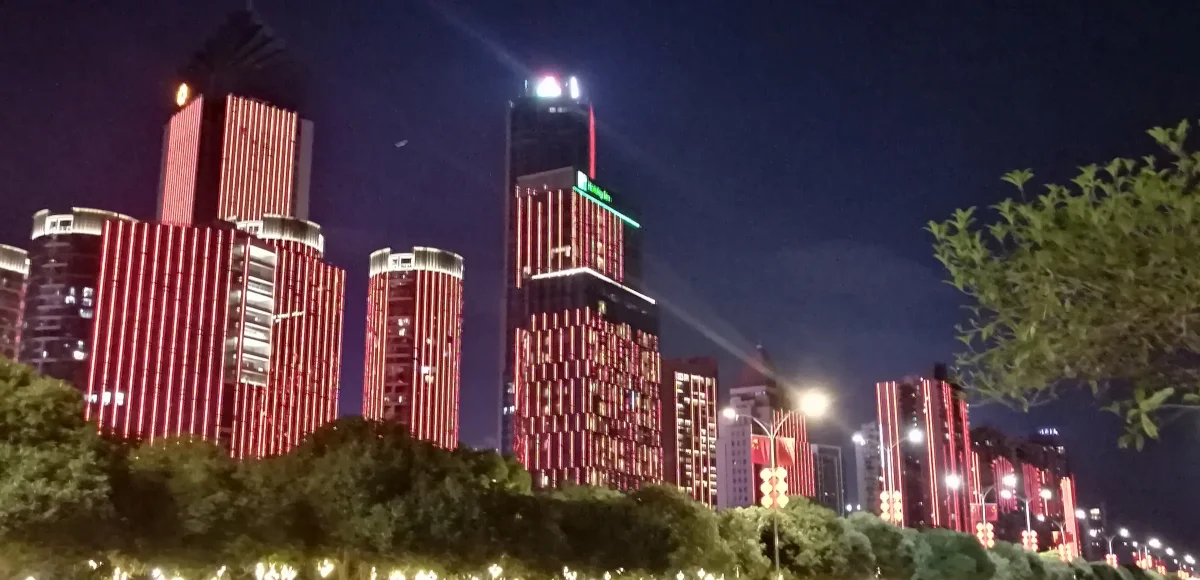 Honggutan riverside CBD buildings lit at night in Nanchang