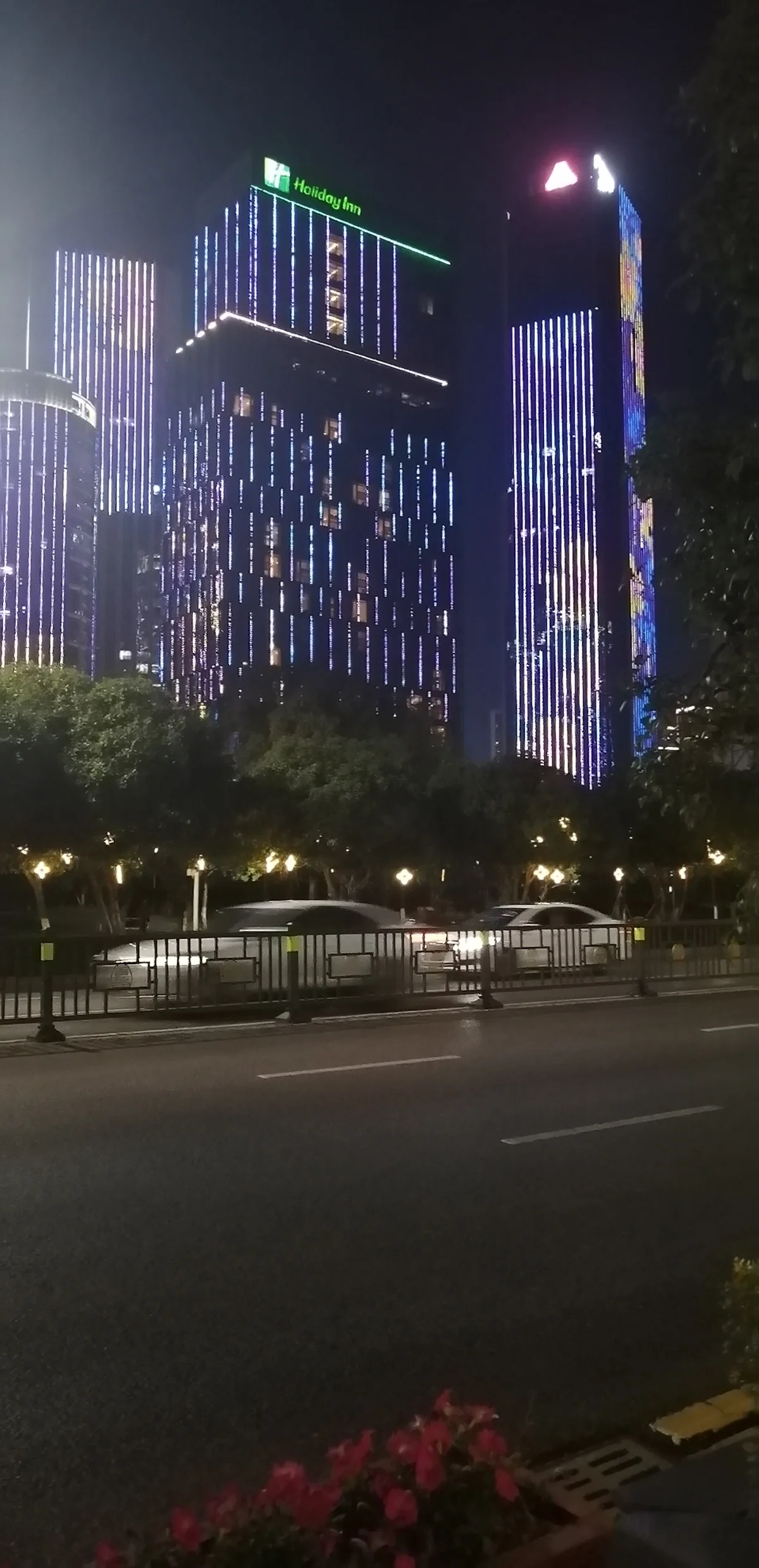 Tall hotel towers in Honggutan District illuminated at night