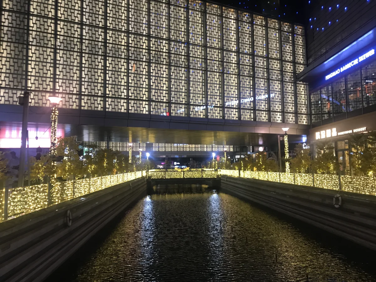Changzhou Injoy Plaza illuminated at night with water and facade lights