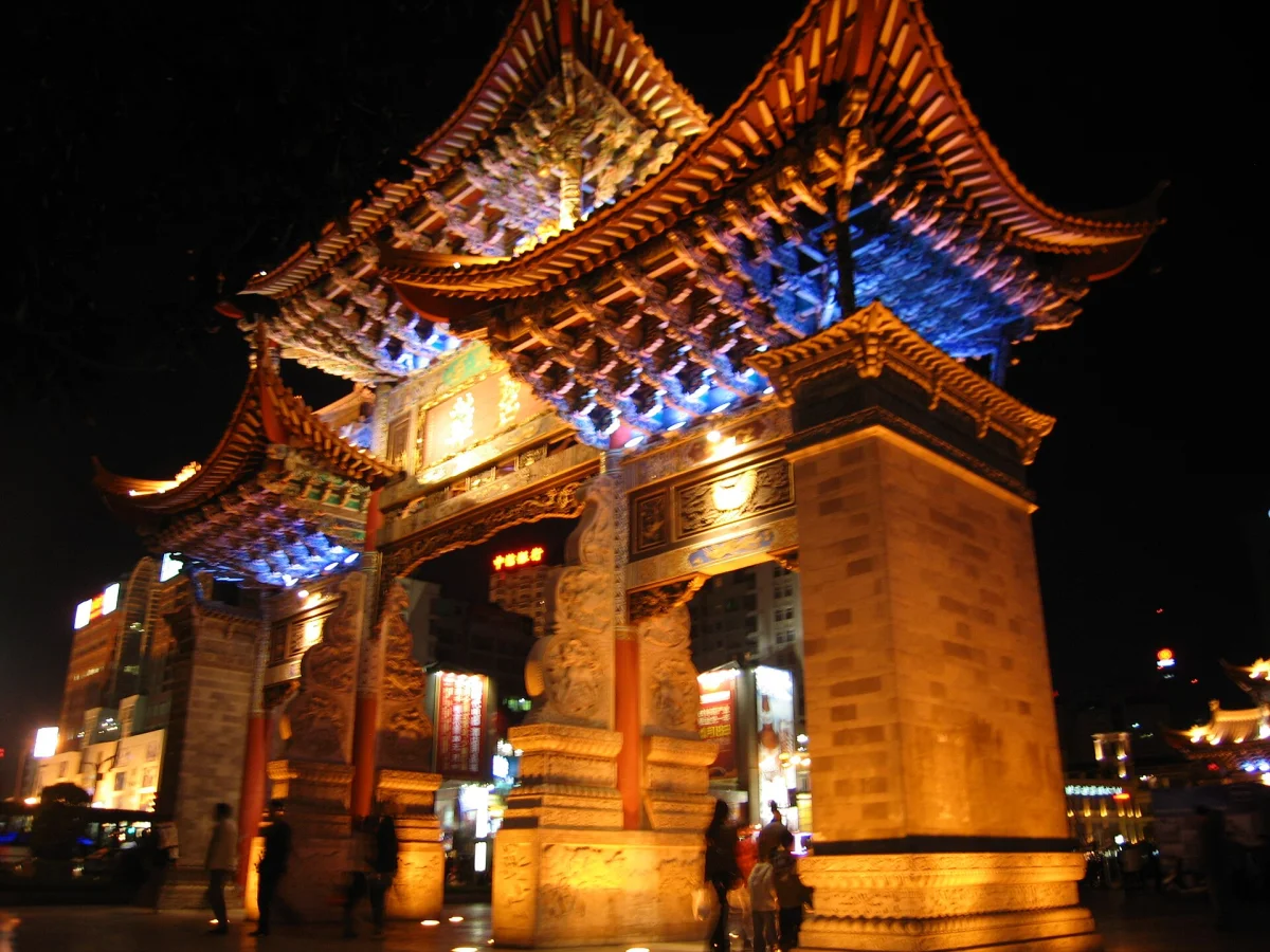 Golden Horse Archway illuminated at night in Kunming