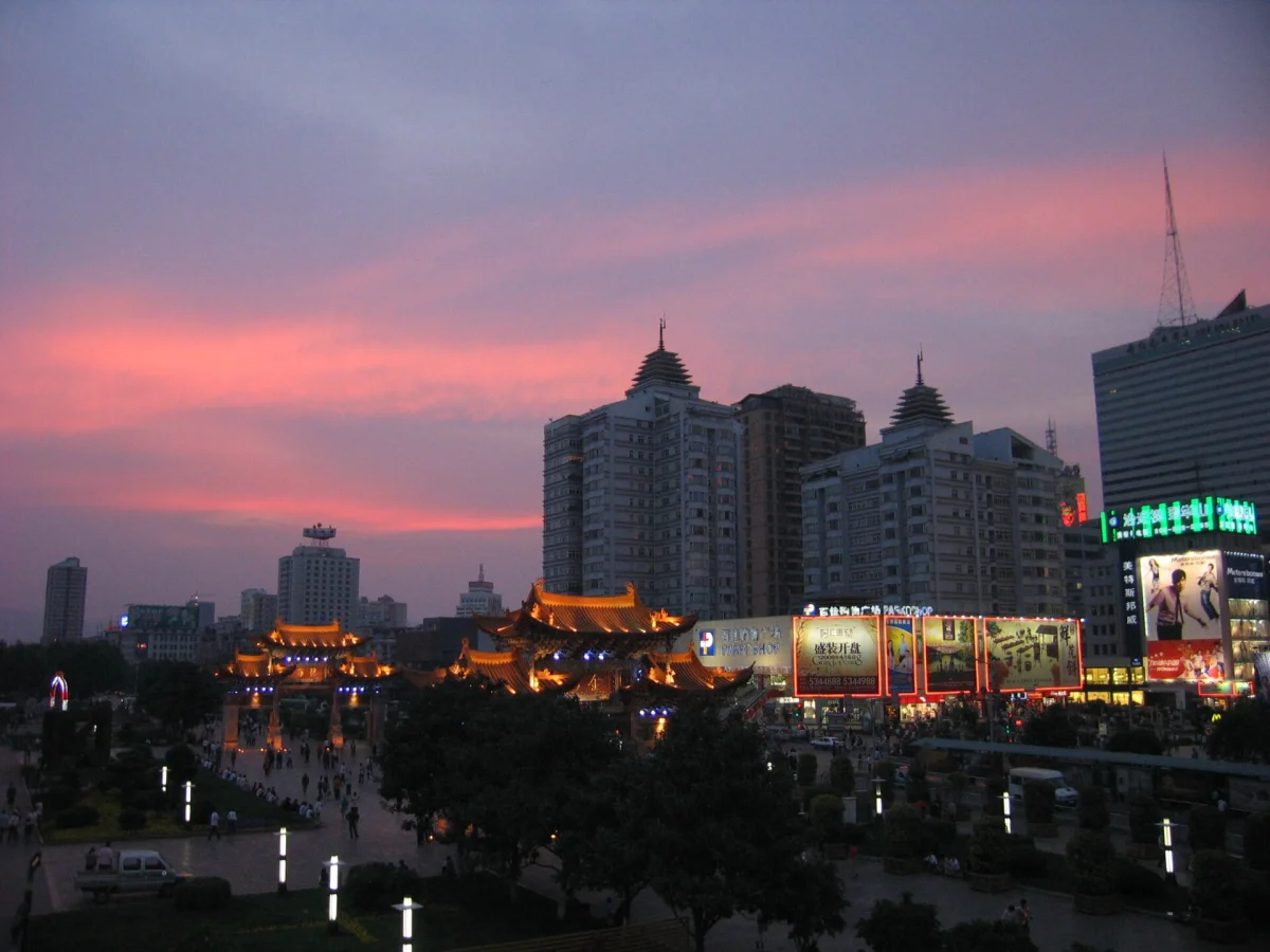 Jinbi Square at sunset with evening lights in Kunming