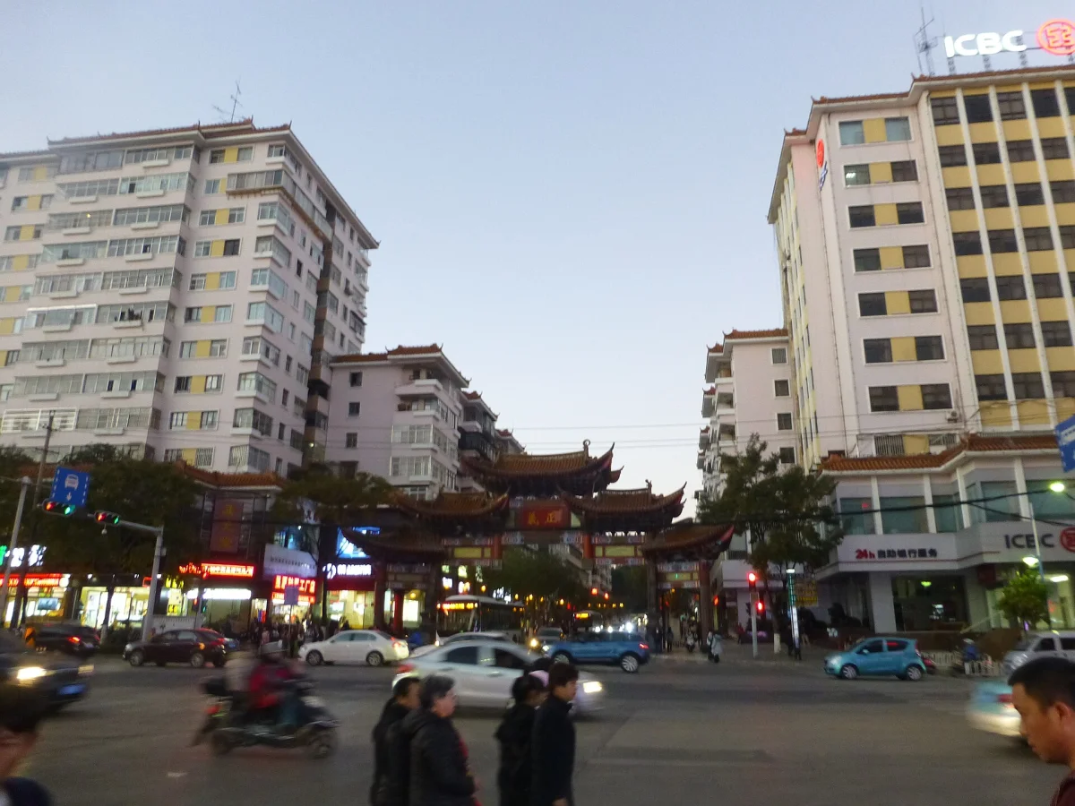 Central Kunming evening street view near historic archways
