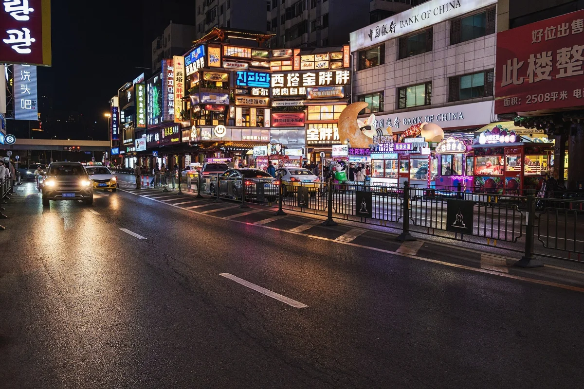Traffic and neon signs on Xita Street at night in Shenyang