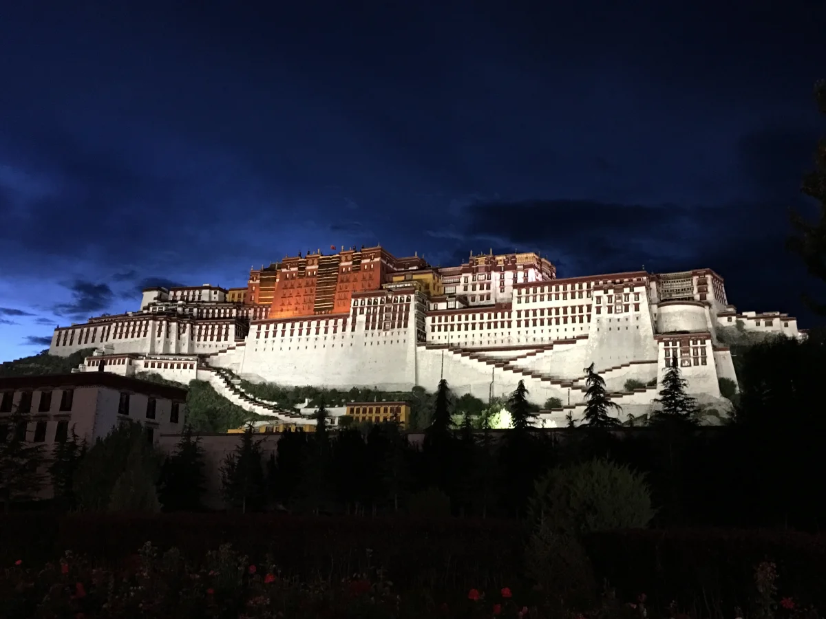Potala Palace illuminated during blue hour in Lhasa