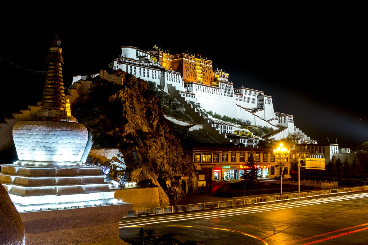 Wide Potala Palace night view with illuminated foreground stupa