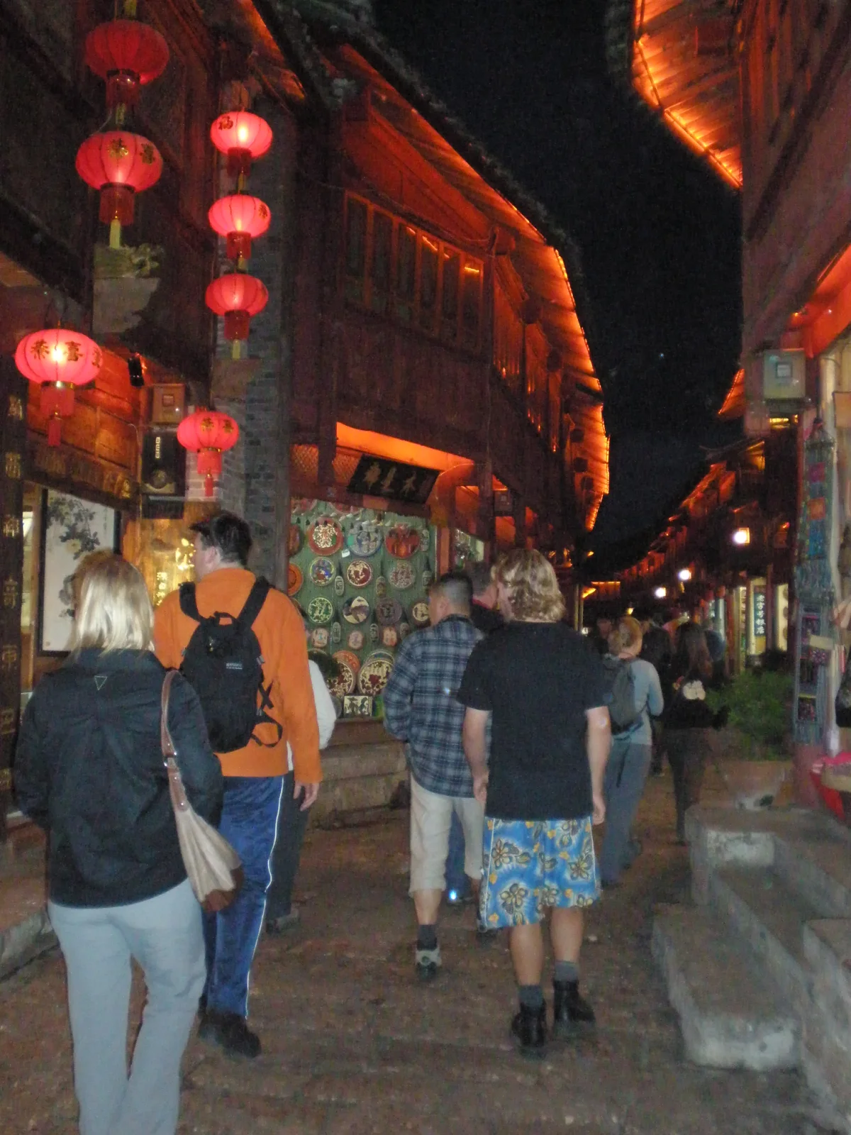 Visitors walking through Lijiang Old Town at night