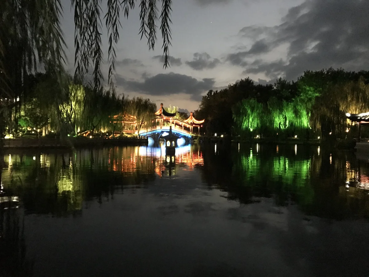 Huixiuqiao Bridge and water reflections in Xitang at blue hour