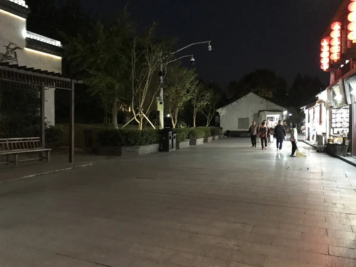 Covered canal-side street near Huixiuqiao Bridge in Xitang at night