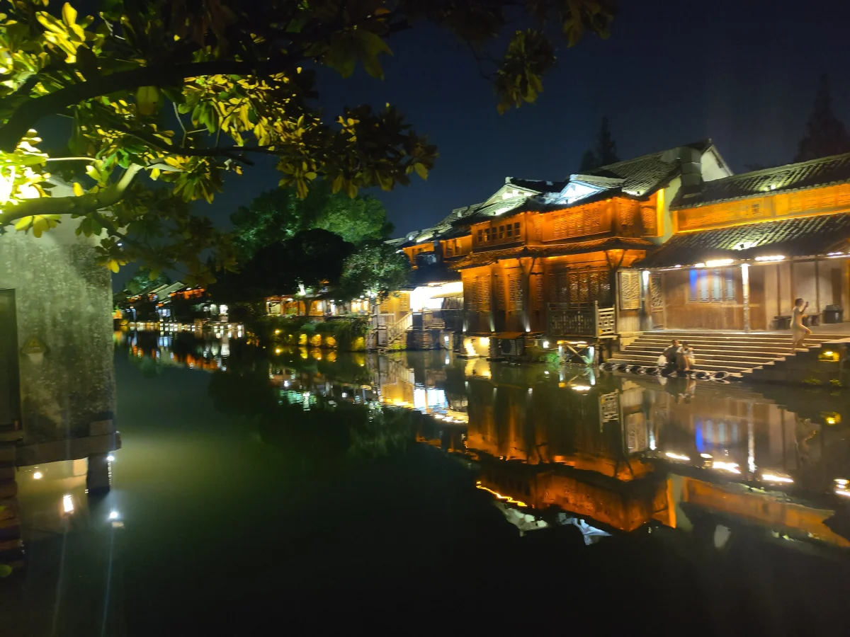 Lantern-lit Wuzhen canal and waterside houses at night