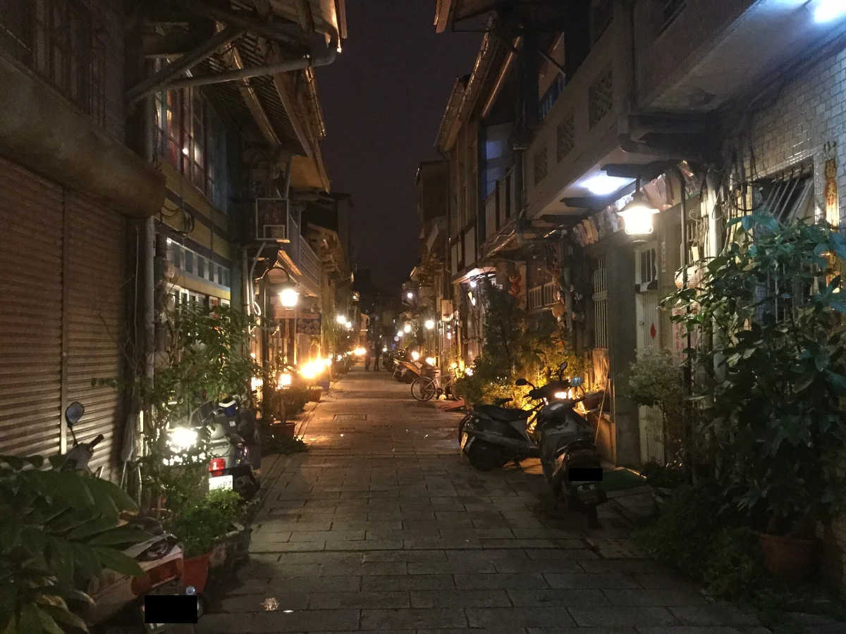 A night view along Shennong Street with old shopfronts