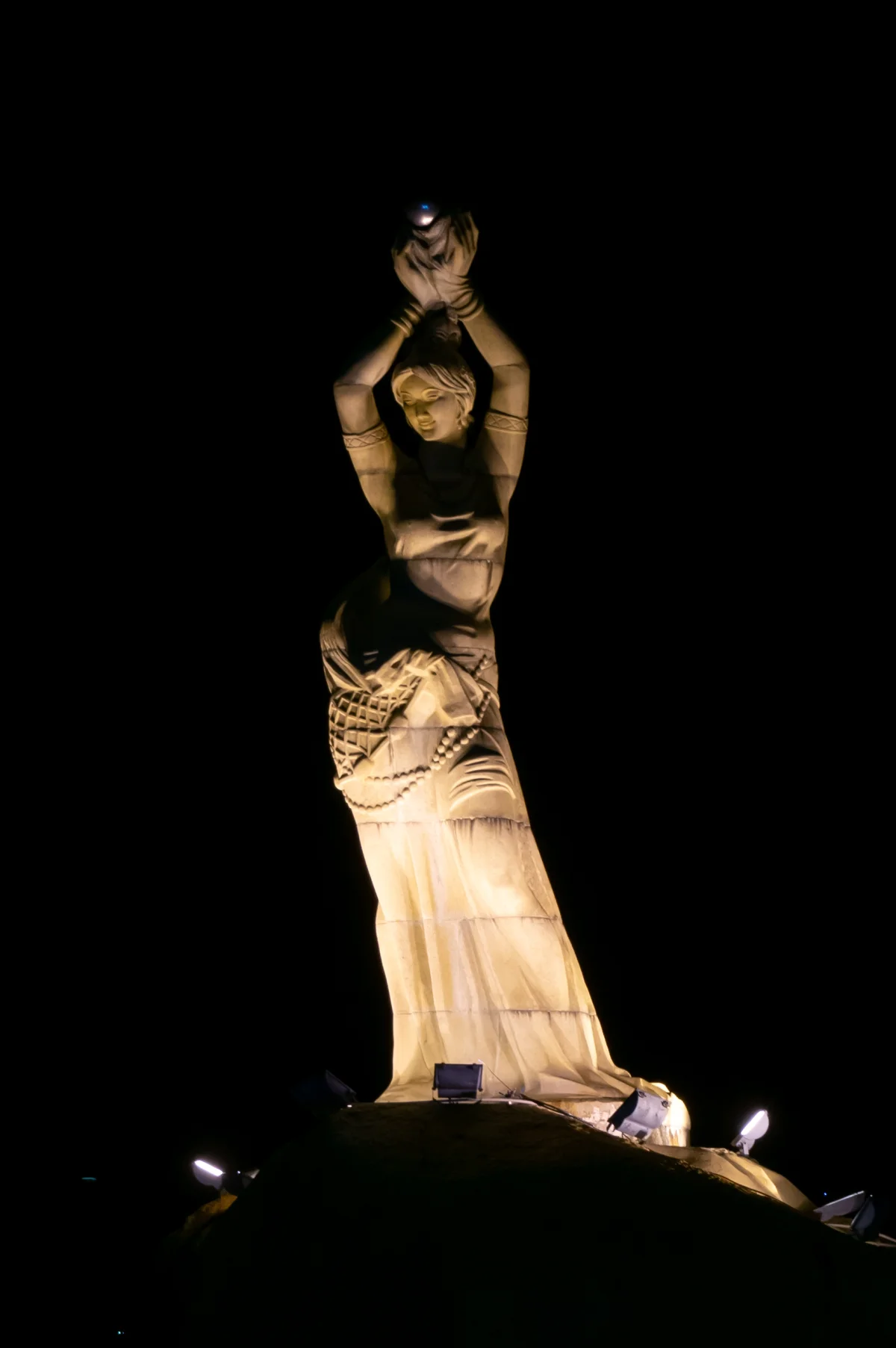 Zhuhai Fisher Girl statue illuminated at night